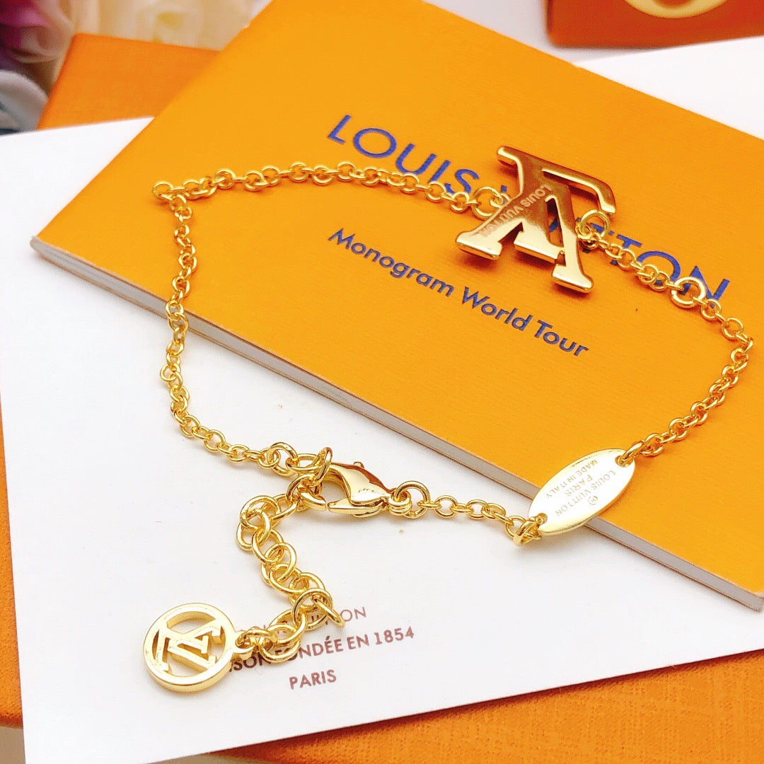 Geometric Emblem Bracelet in Gold-Tone – Red Detail detail view