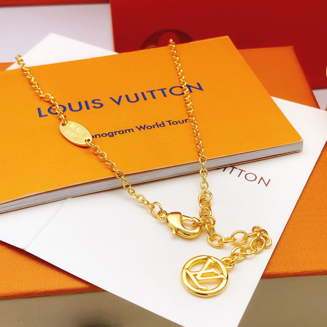 Geometric Emblem Pendant Necklace in Gold-Tone – Red Detail detail view