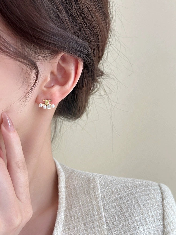 Martin Graham stud earrings in polished metal-tone