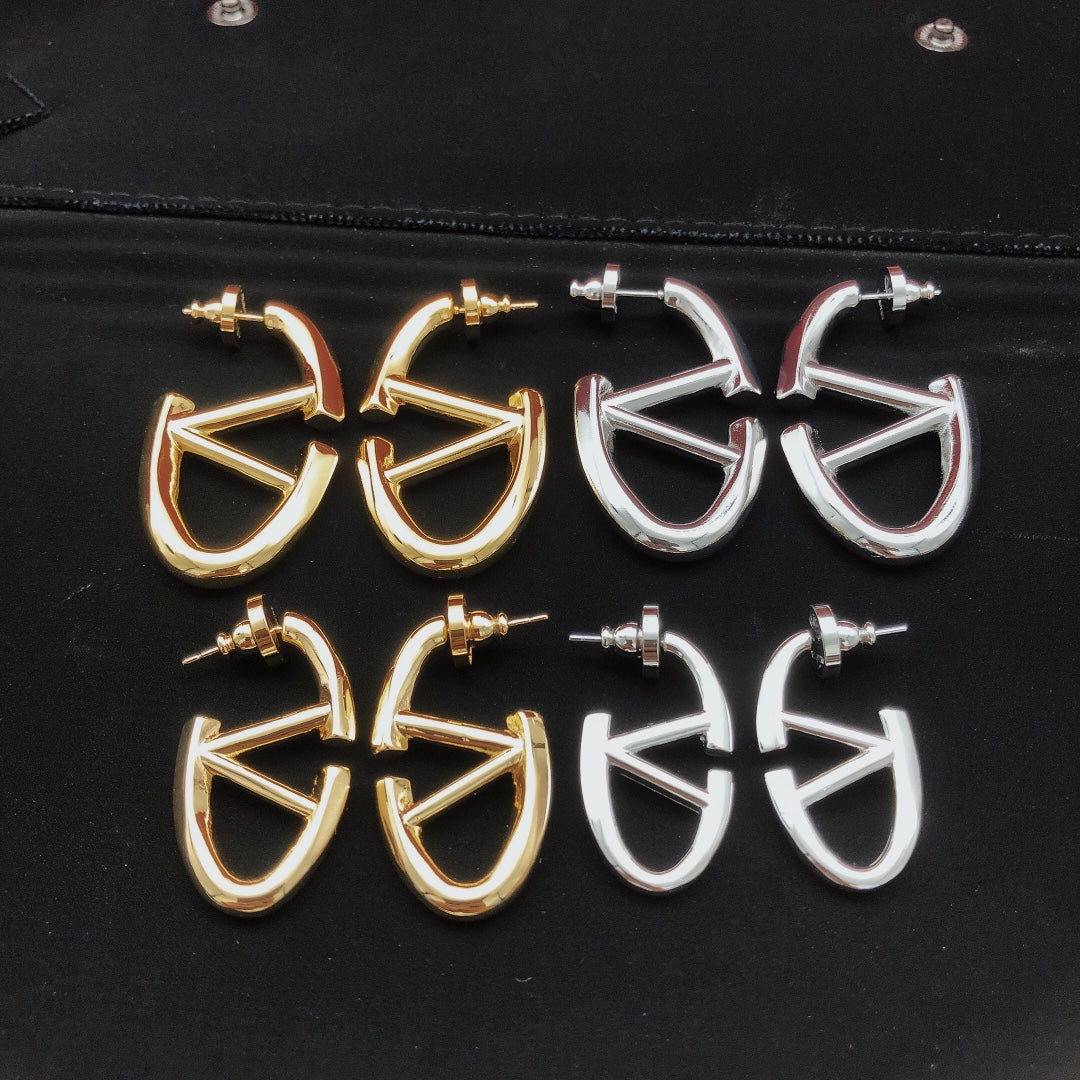 Martin Graham drop earrings in polished metal-tone