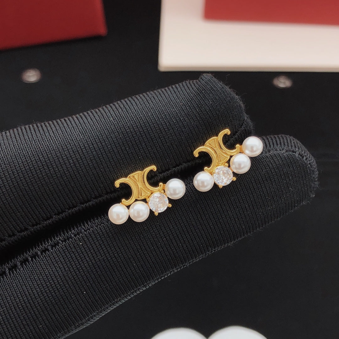 Martin Graham stud earrings in polished metal-tone – main product view