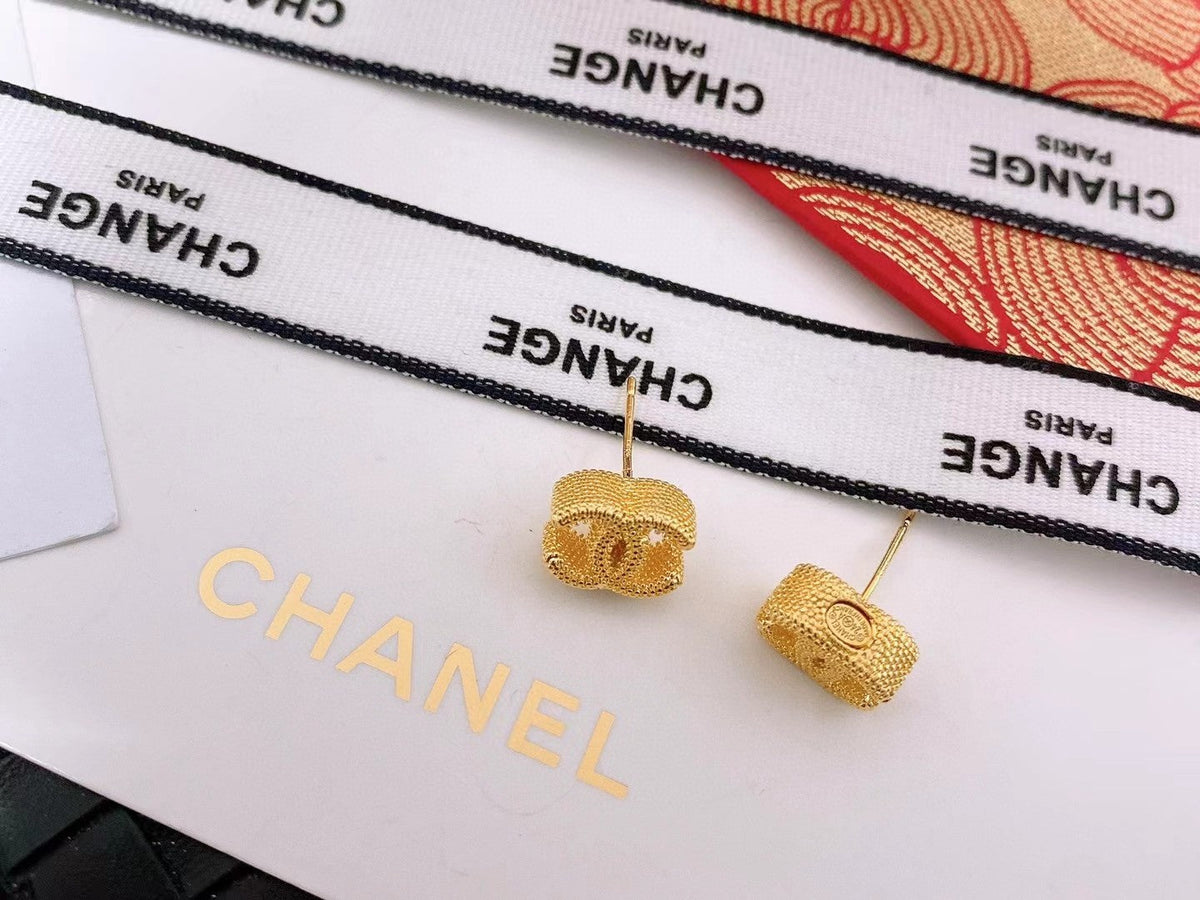Martin Graham stud earrings in polished metal-tone – detail view
