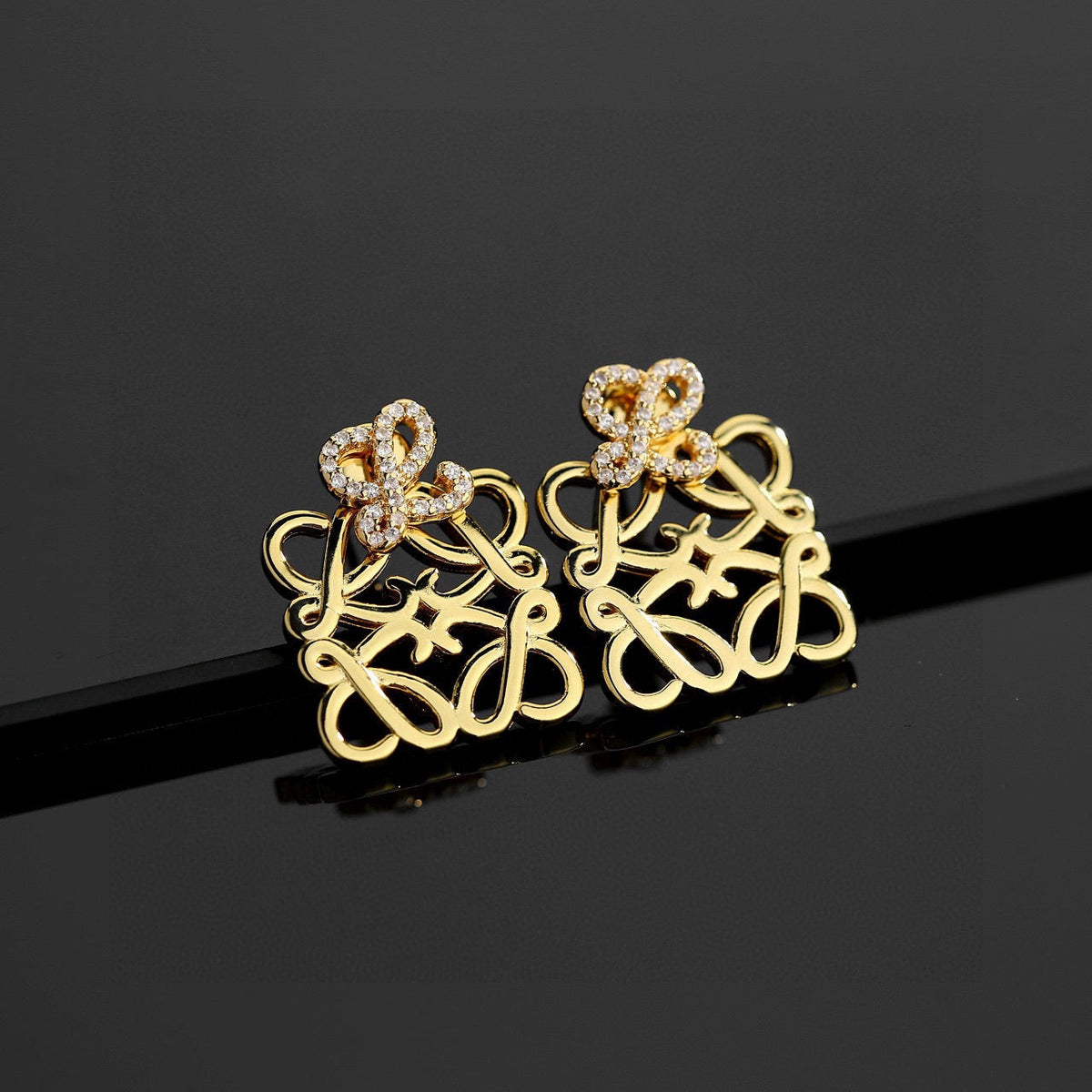 Martin Graham stud earrings in polished metal-tone – main product view