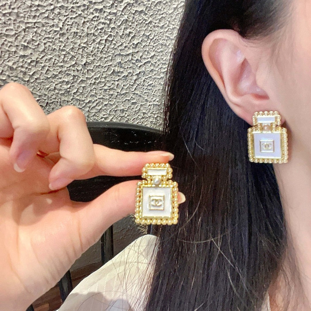 Martin Graham stud earrings in polished metal-tone – main product view