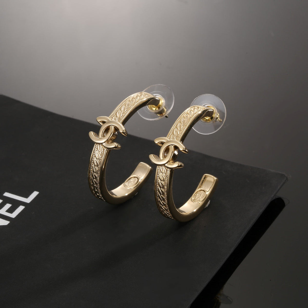Martin Graham stud earrings in polished metal-tone – main product view