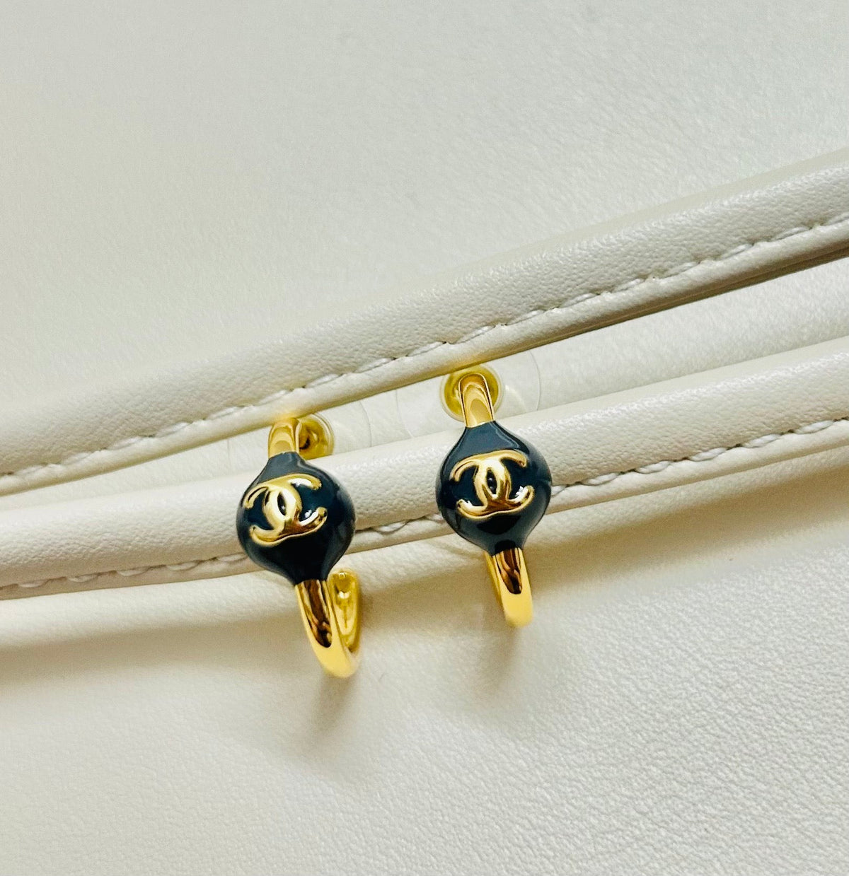 Martin Graham stud earrings in polished metal-tone – main product view