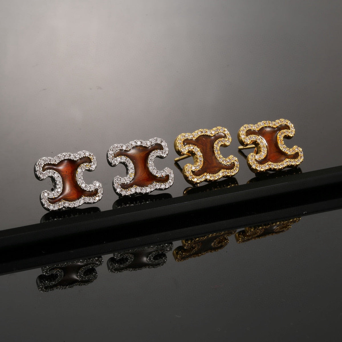 Martin Graham stud earrings in polished metal-tone – main product view