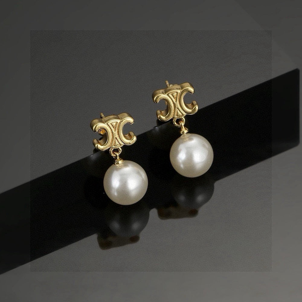 Martin Graham stud earrings in polished metal-tone – main product view