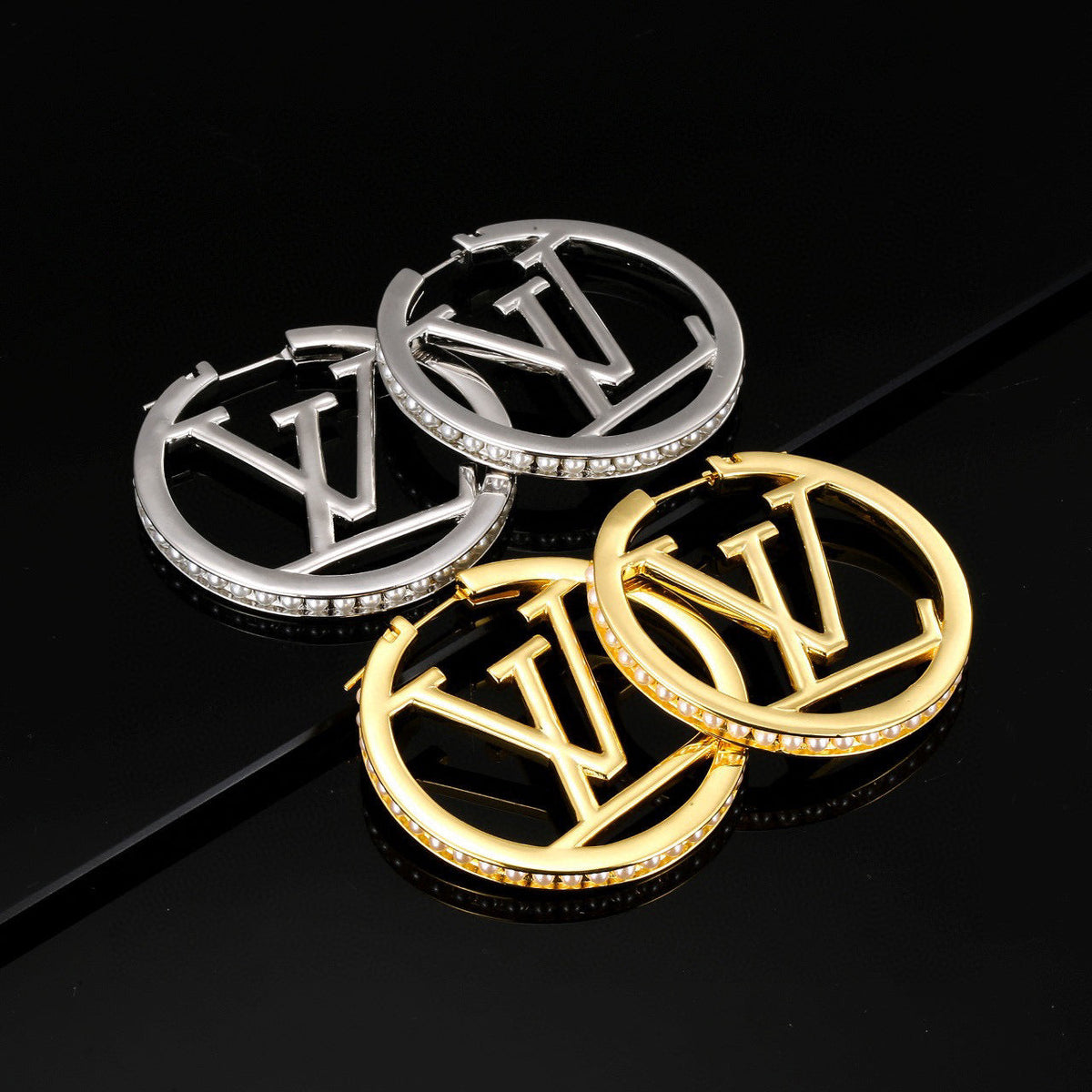Martin Graham stud earrings in polished metal-tone – main product view