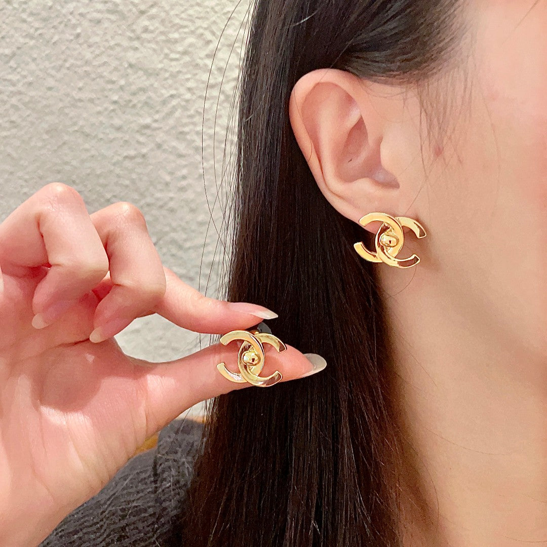 Martin Graham stud earrings in polished metal-tone – main product view