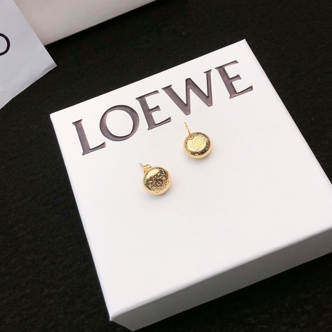 Martin Graham stud earrings in polished metal-tone – main product view