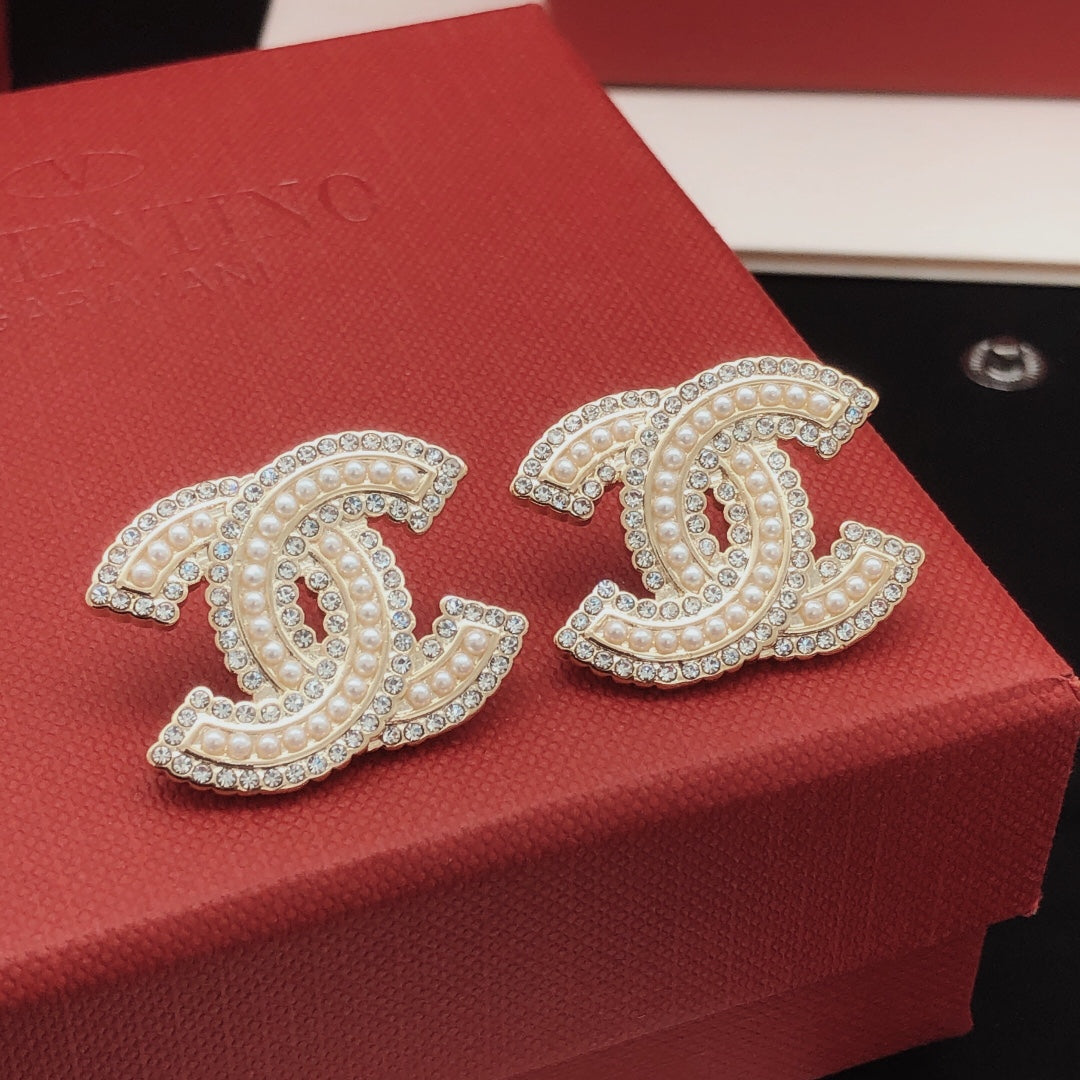 Martin Graham stud earrings in polished metal-tone – main product view