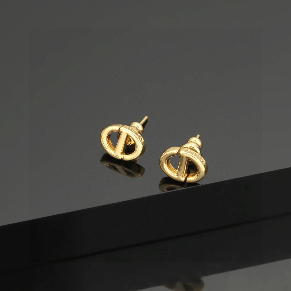 Martin Graham stud earrings in polished metal-tone – main product view