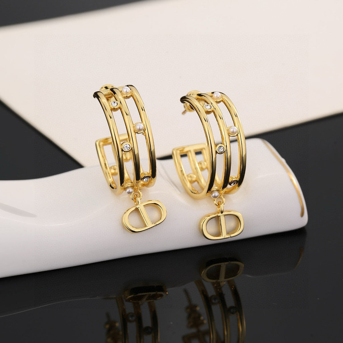 Martin Graham stud earrings in polished metal-tone – main product view