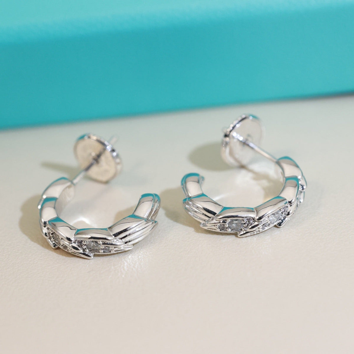Martin Graham stud earrings in polished metal-tone – main product view