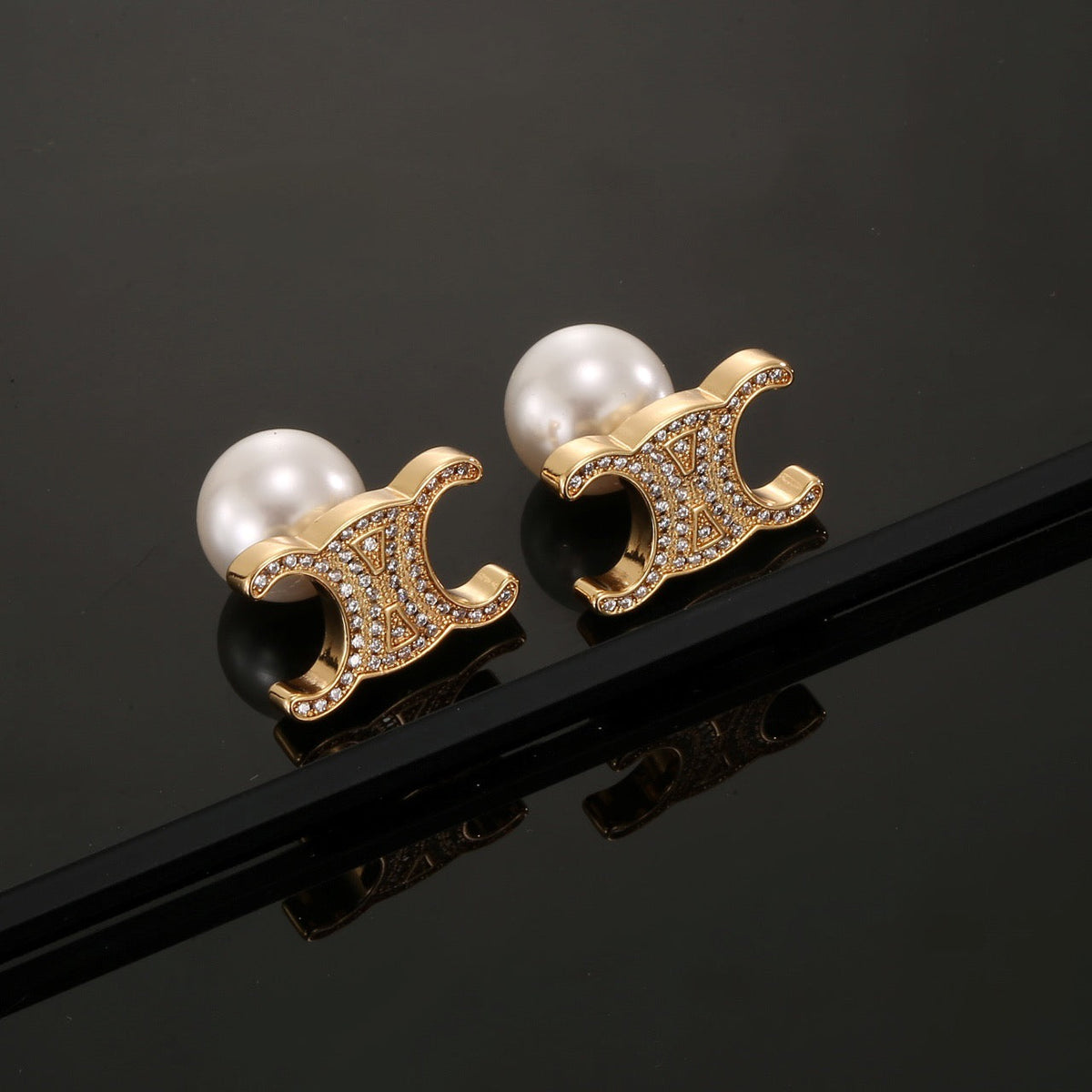 Martin Graham stud earrings in polished metal-tone – main product view