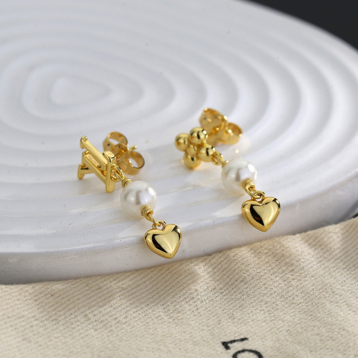 Martin Graham stud earrings in polished metal-tone – main product view