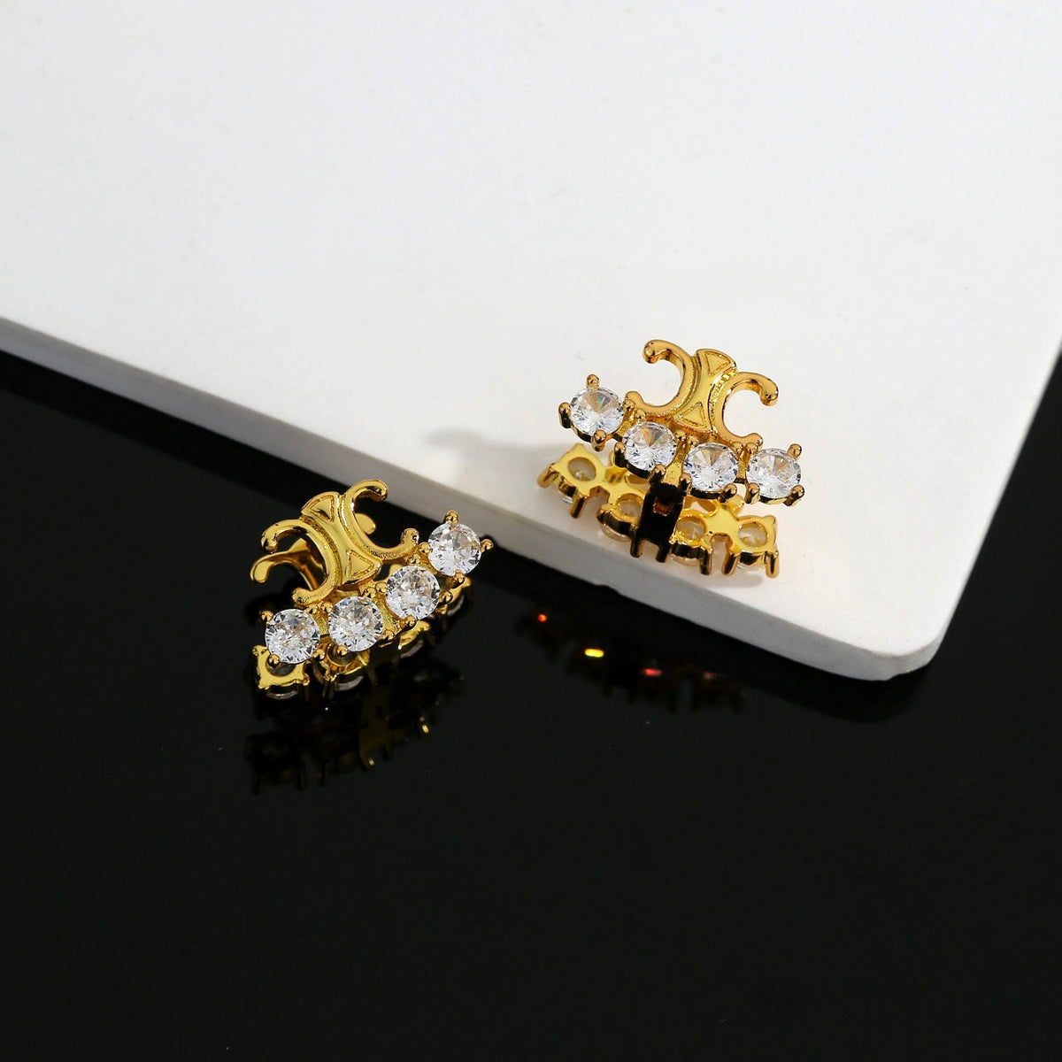 Martin Graham stud earrings in polished metal-tone – main product view