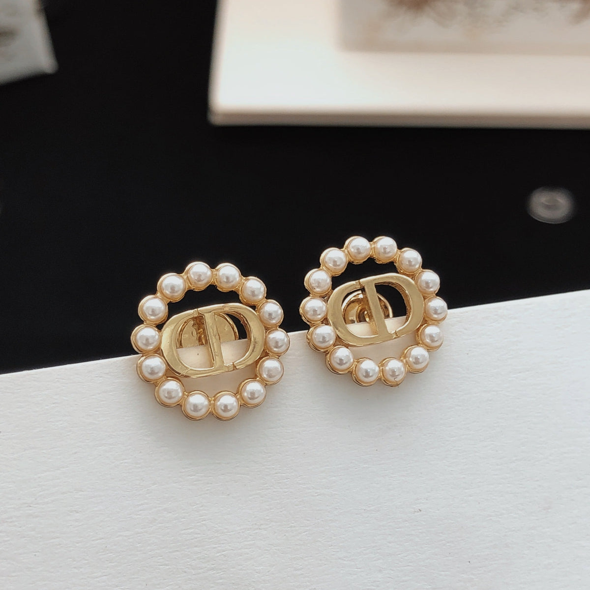 Martin Graham stud earrings in polished metal-tone – main product view