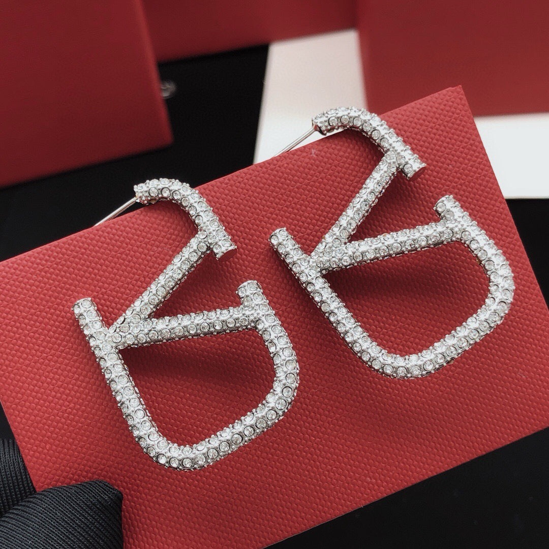 Martin Graham stud earrings in polished metal-tone – main product view