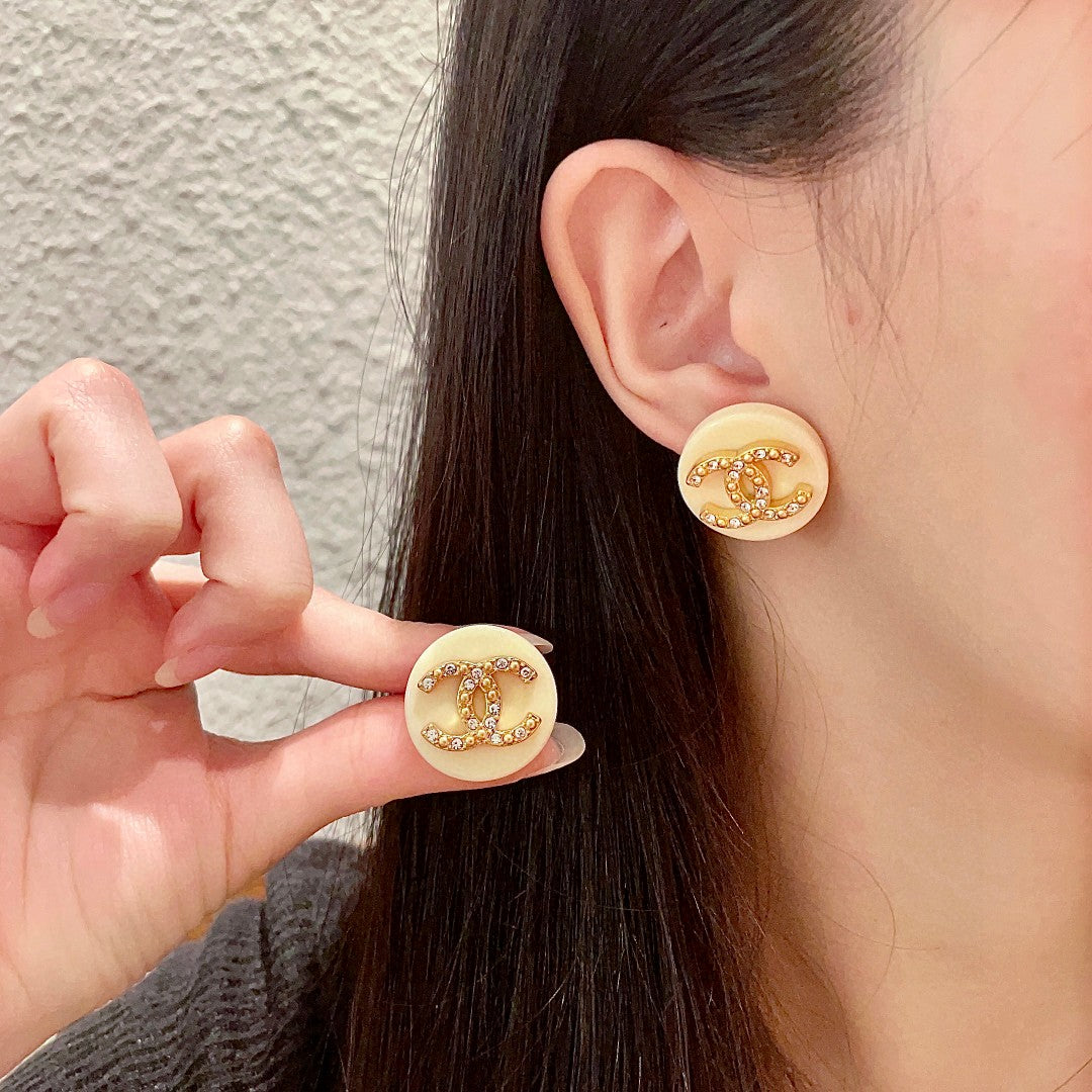 Martin Graham stud earrings in polished metal-tone – main product view
