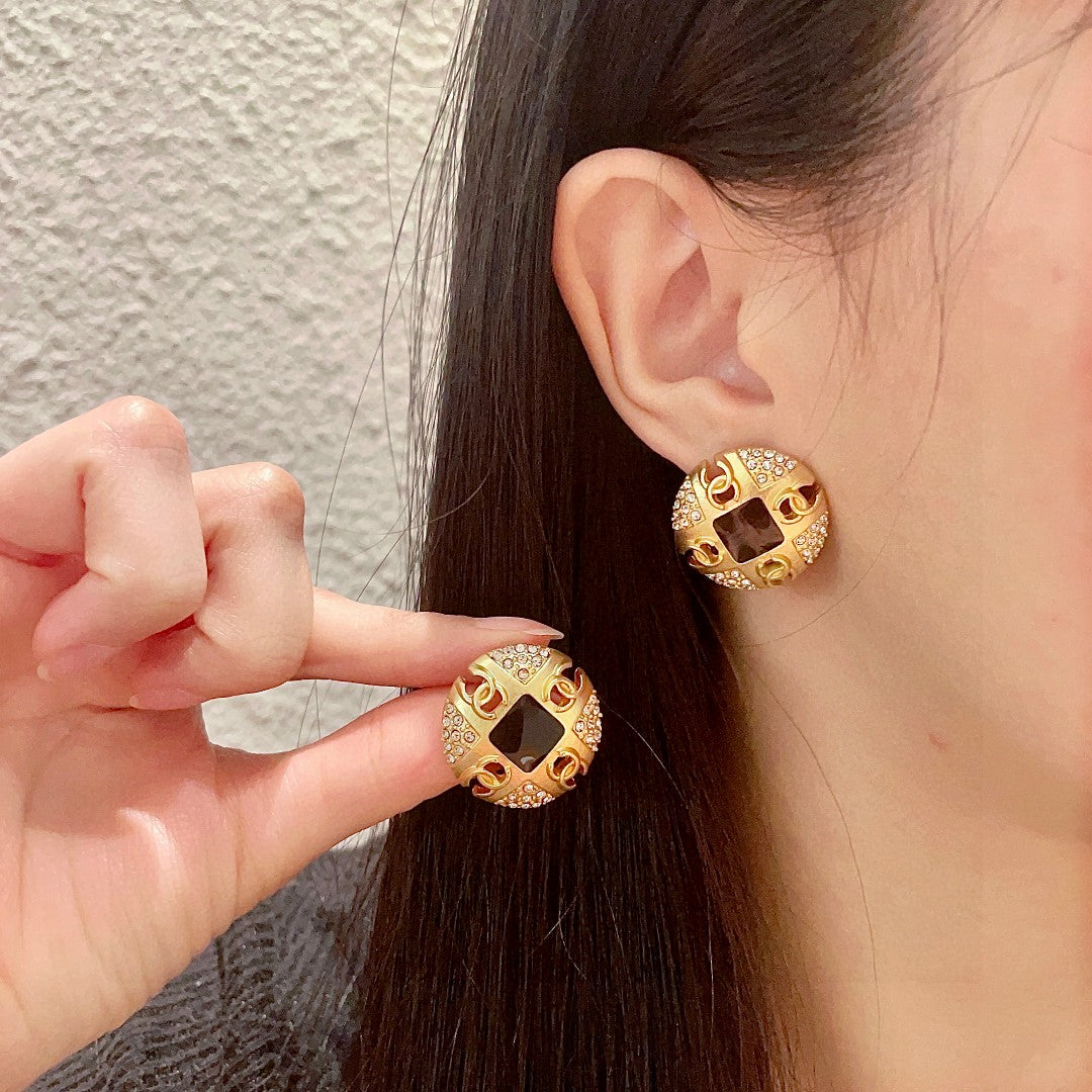 Martin Graham stud earrings in polished metal-tone – main product view