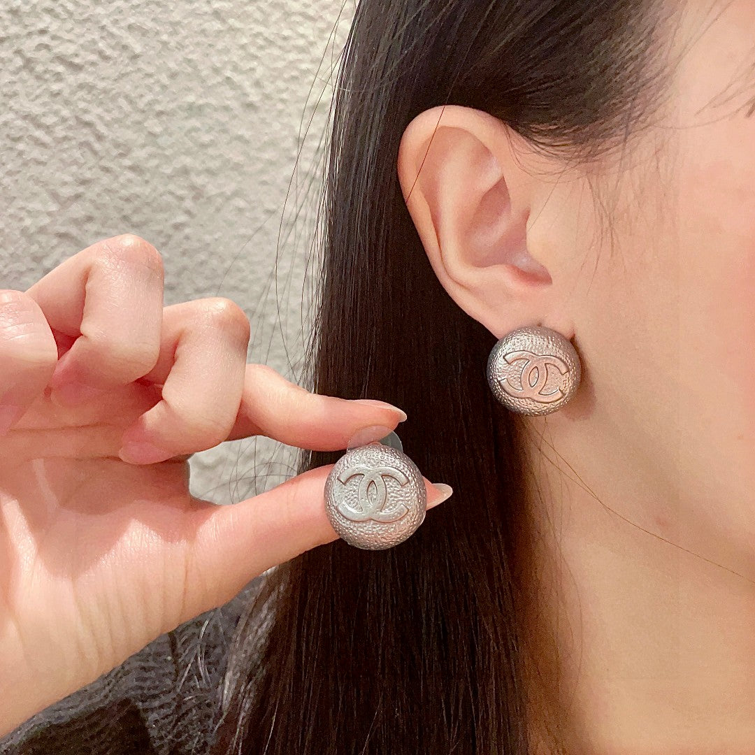 Martin Graham stud earrings in polished metal-tone – main product view