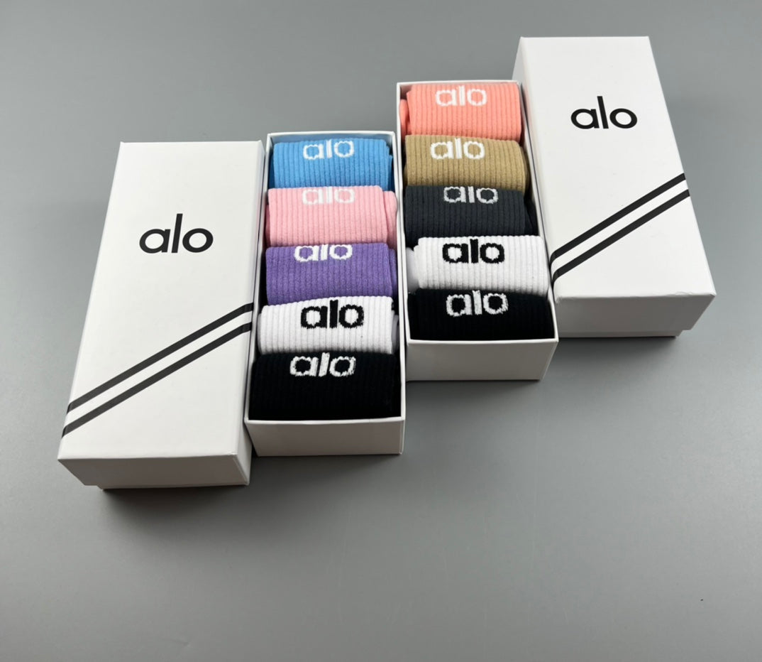 Alo cotton athletic socks displayed in presentation boxes with assorted colors