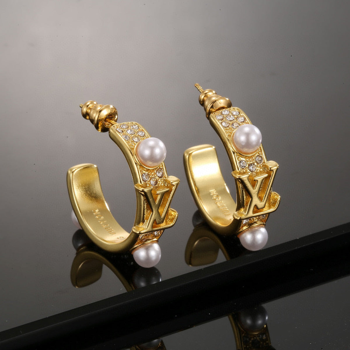 Martin Graham stud earrings in polished metal-tone – main product view