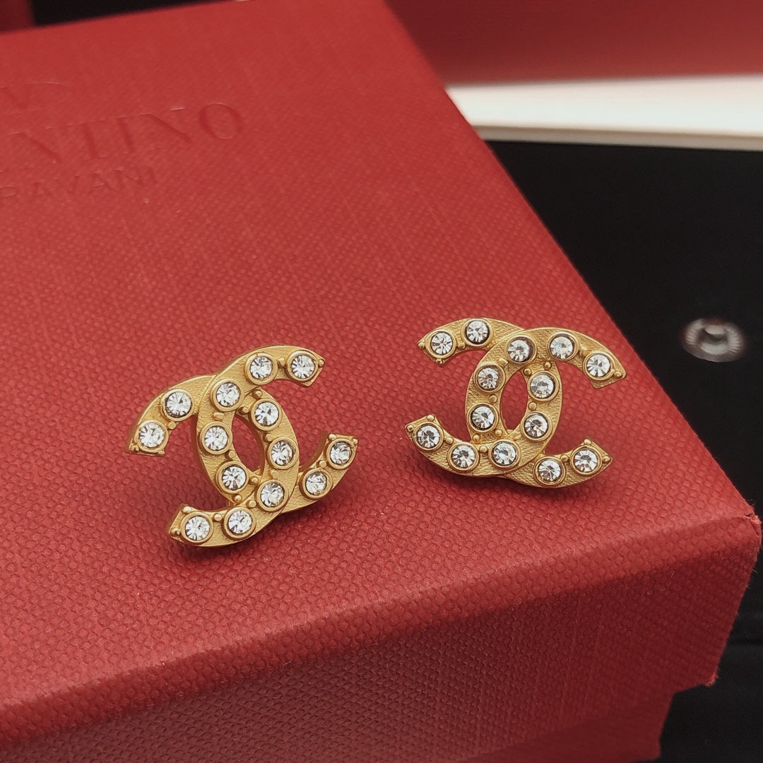 Martin Graham stud earrings in polished metal-tone – main product view