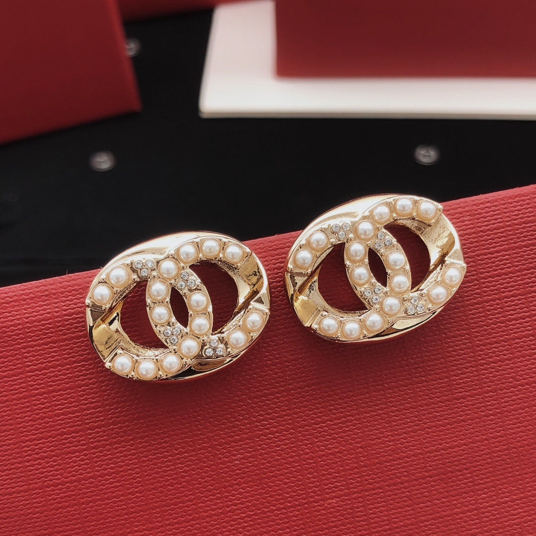 Martin Graham stud earrings in polished metal-tone – main product view
