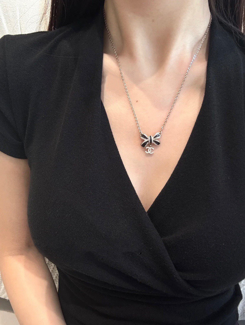 Martin Graham Bow pendant necklace in polished metal-tone – main product view