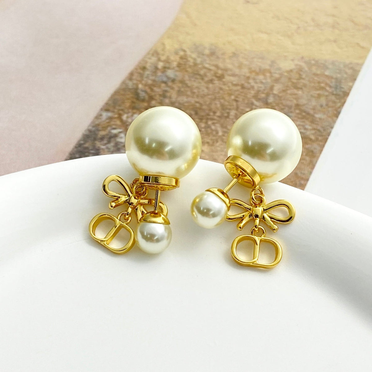 Martin Graham stud earrings in polished metal-tone – main product view