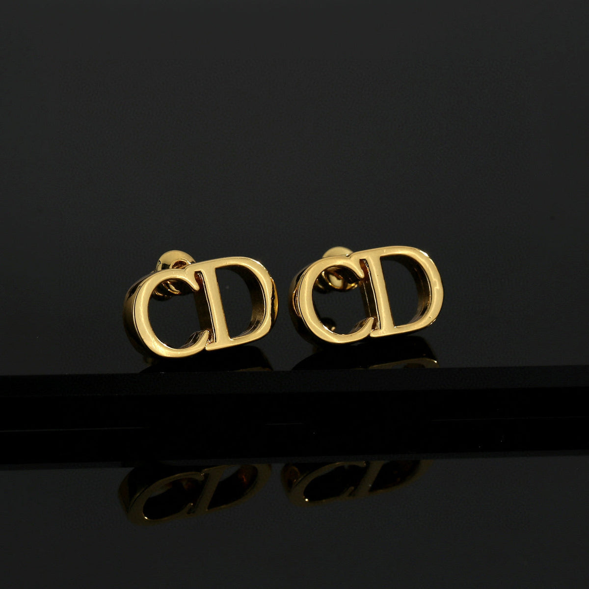Martin Graham earrings in polished metal-tone – main product view