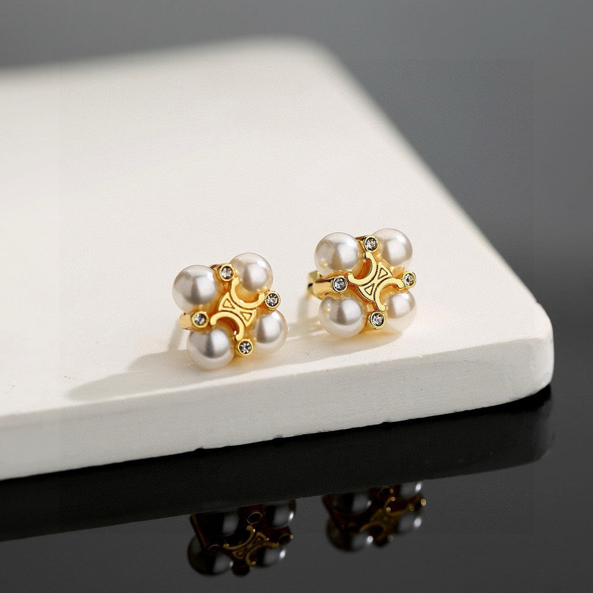 Martin Graham stud earrings in polished metal-tone – main product view