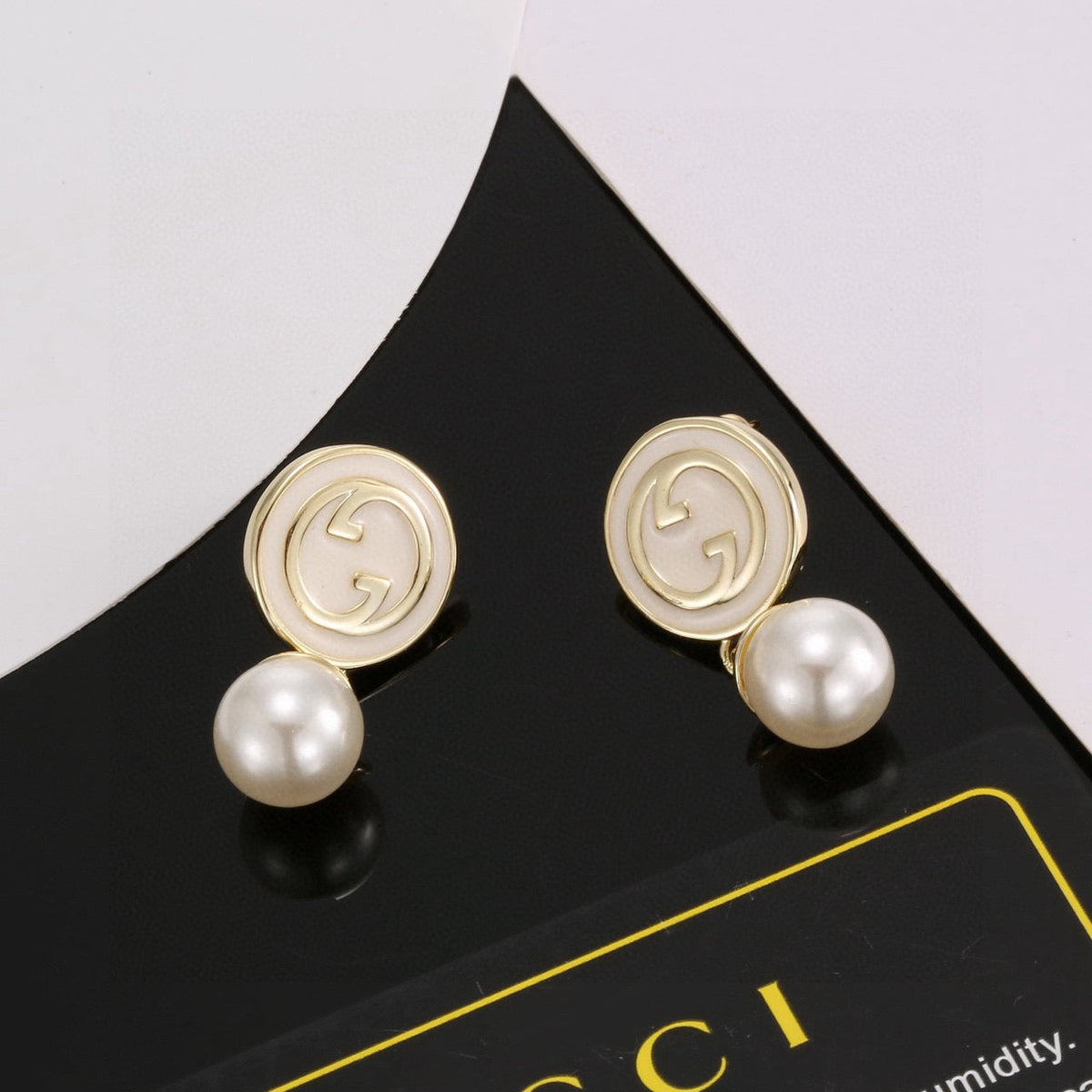 Martin Graham stud earrings in polished metal-tone – main product view