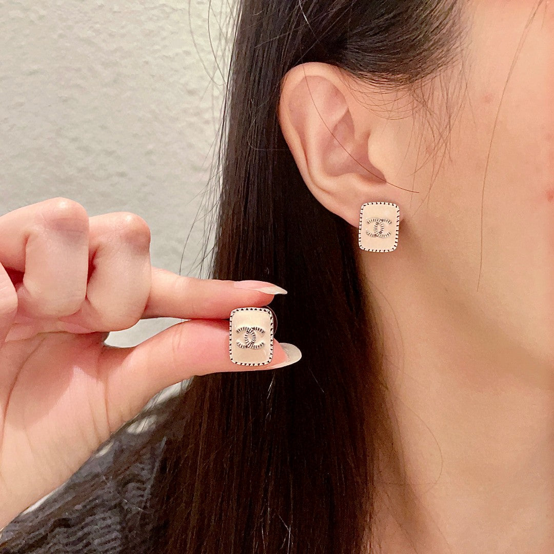 Martin Graham stud earrings in polished metal-tone – main product view