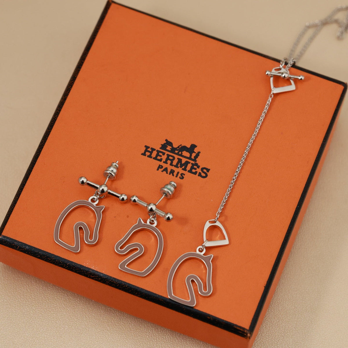 Martin Graham stud earrings in polished metal-tone – main product view