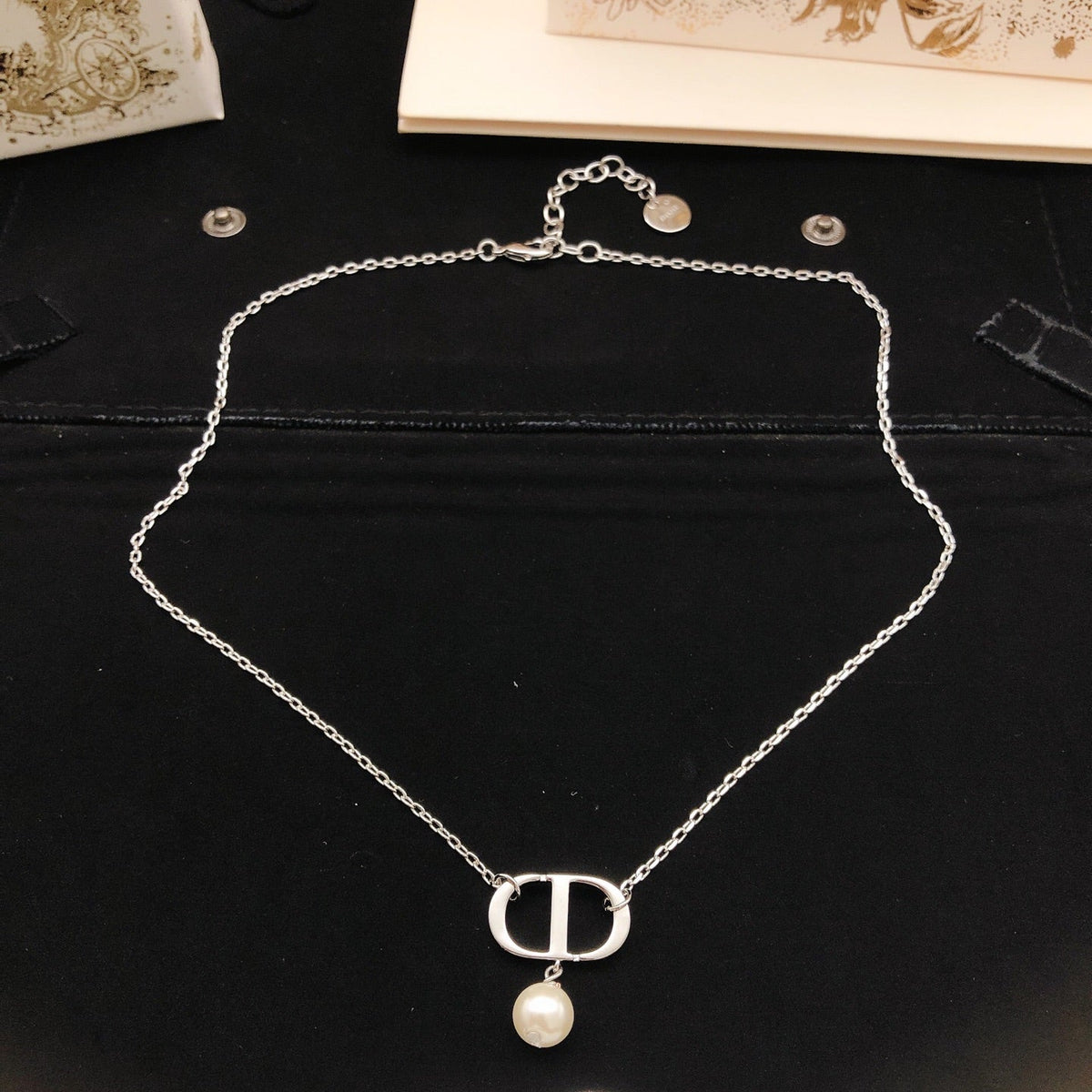 Martin Graham pendant necklace in polished metal-tone – front view