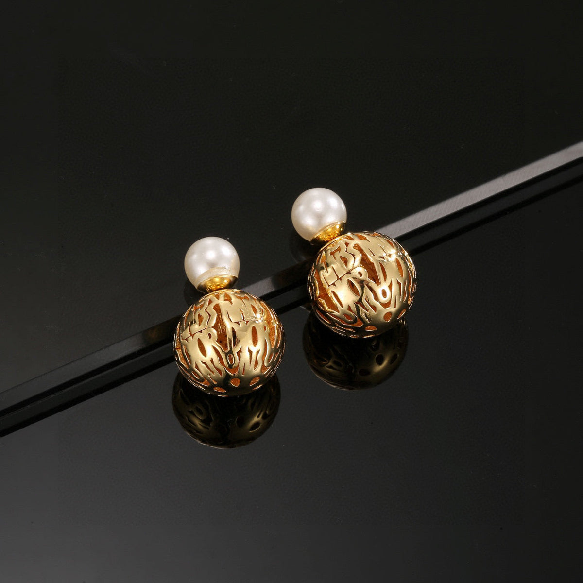 Martin Graham earrings in polished metal-tone – front view