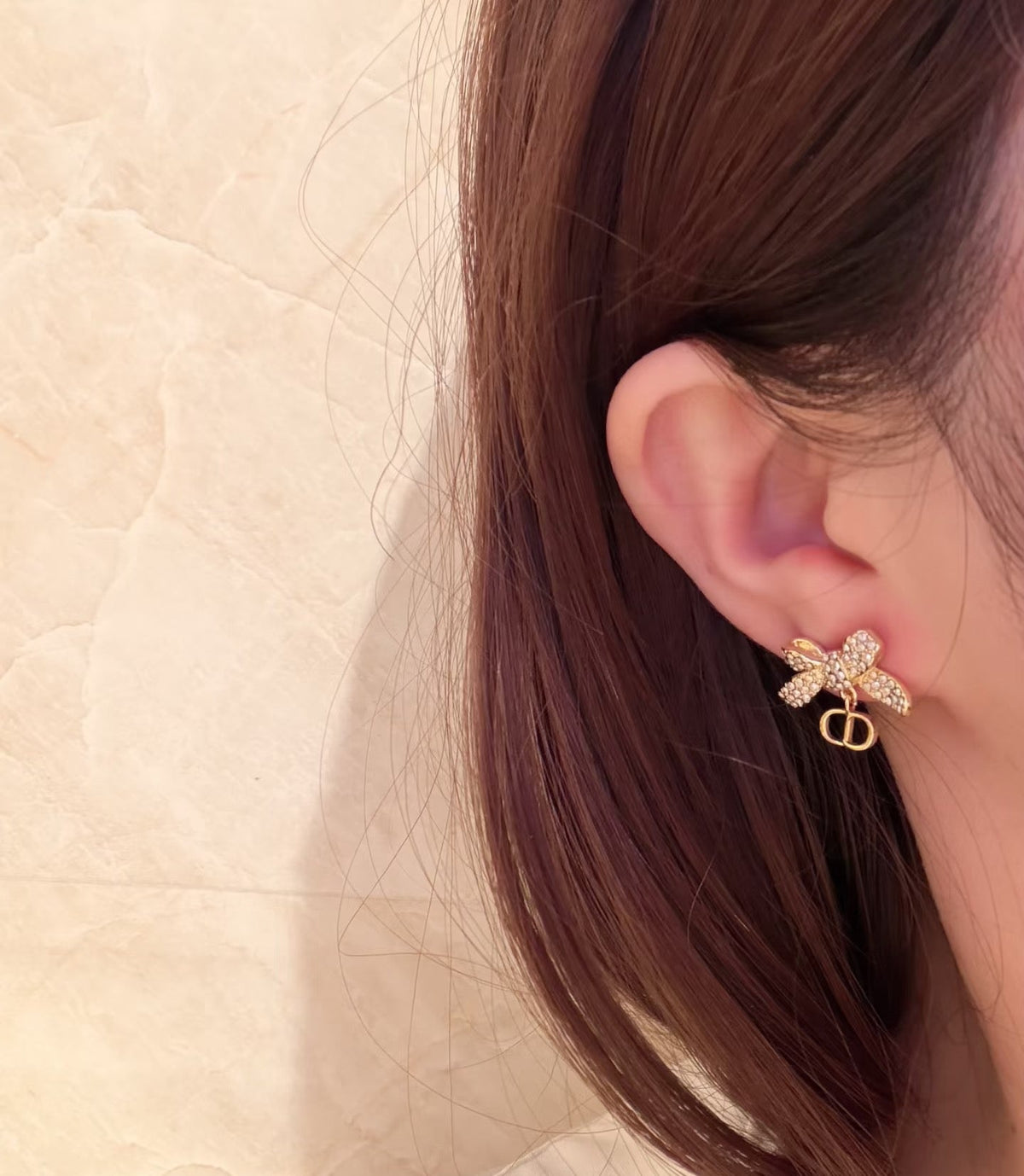 Martin Graham stud earrings in polished metal-tone – front view
