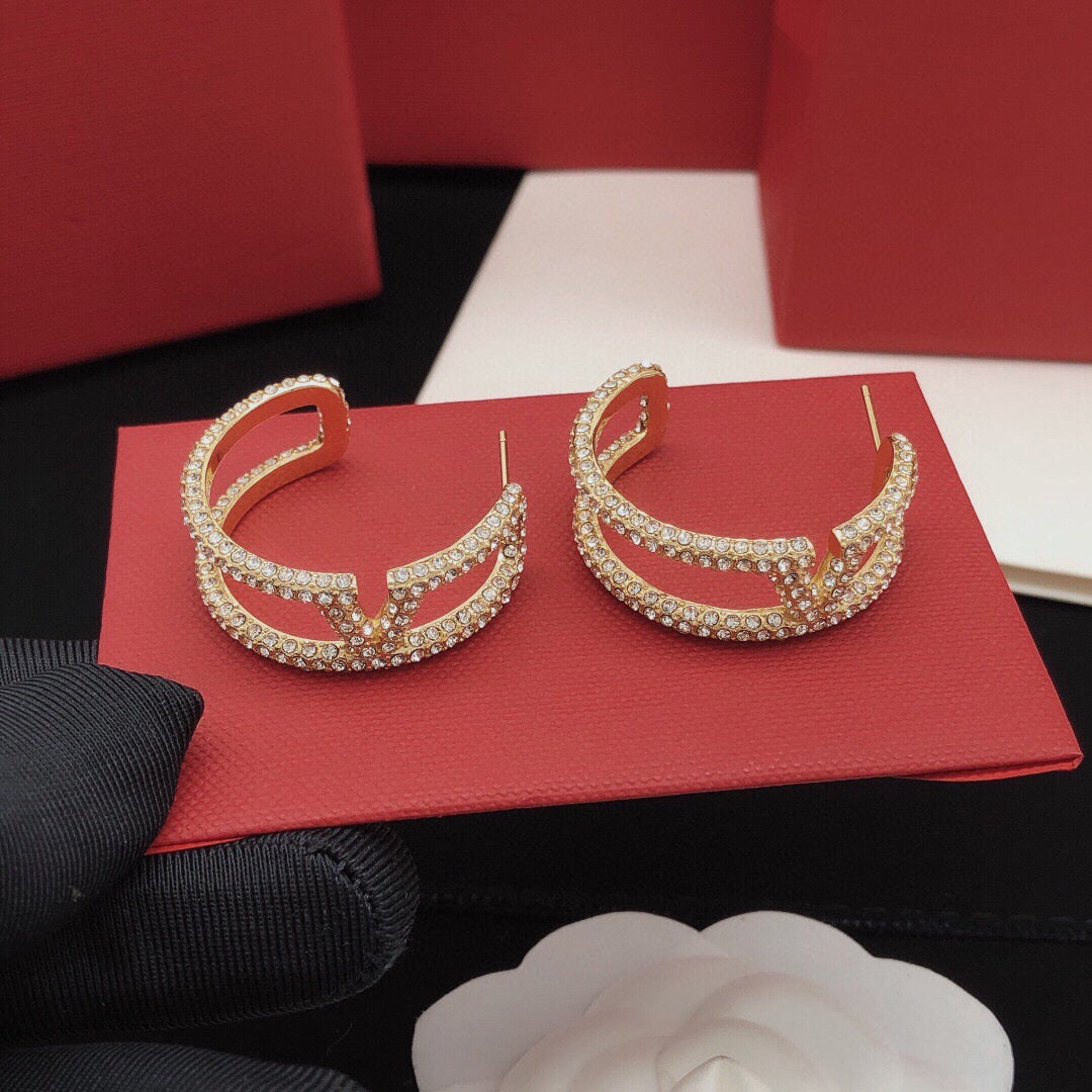 Martin Graham earrings in polished metal-tone – front view
