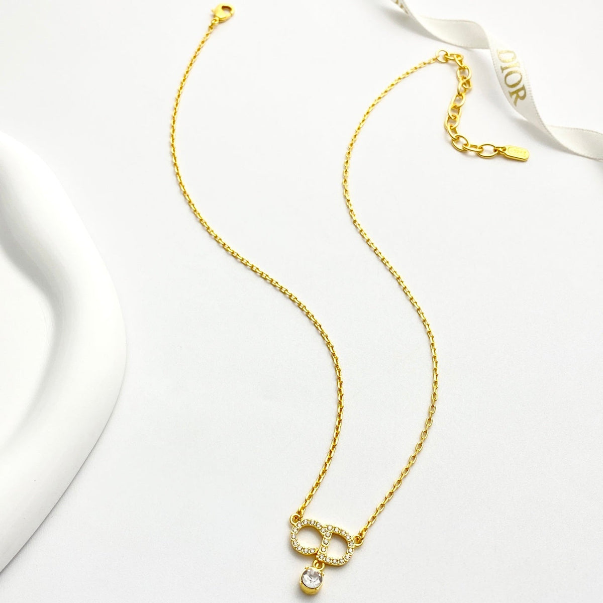 Martin Graham pendant necklace in polished metal-tone – front view