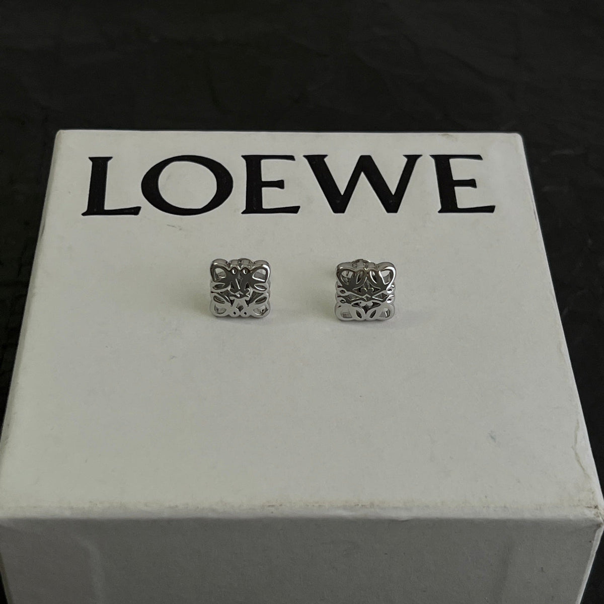 Martin Graham stud earrings in polished metal-tone – front view