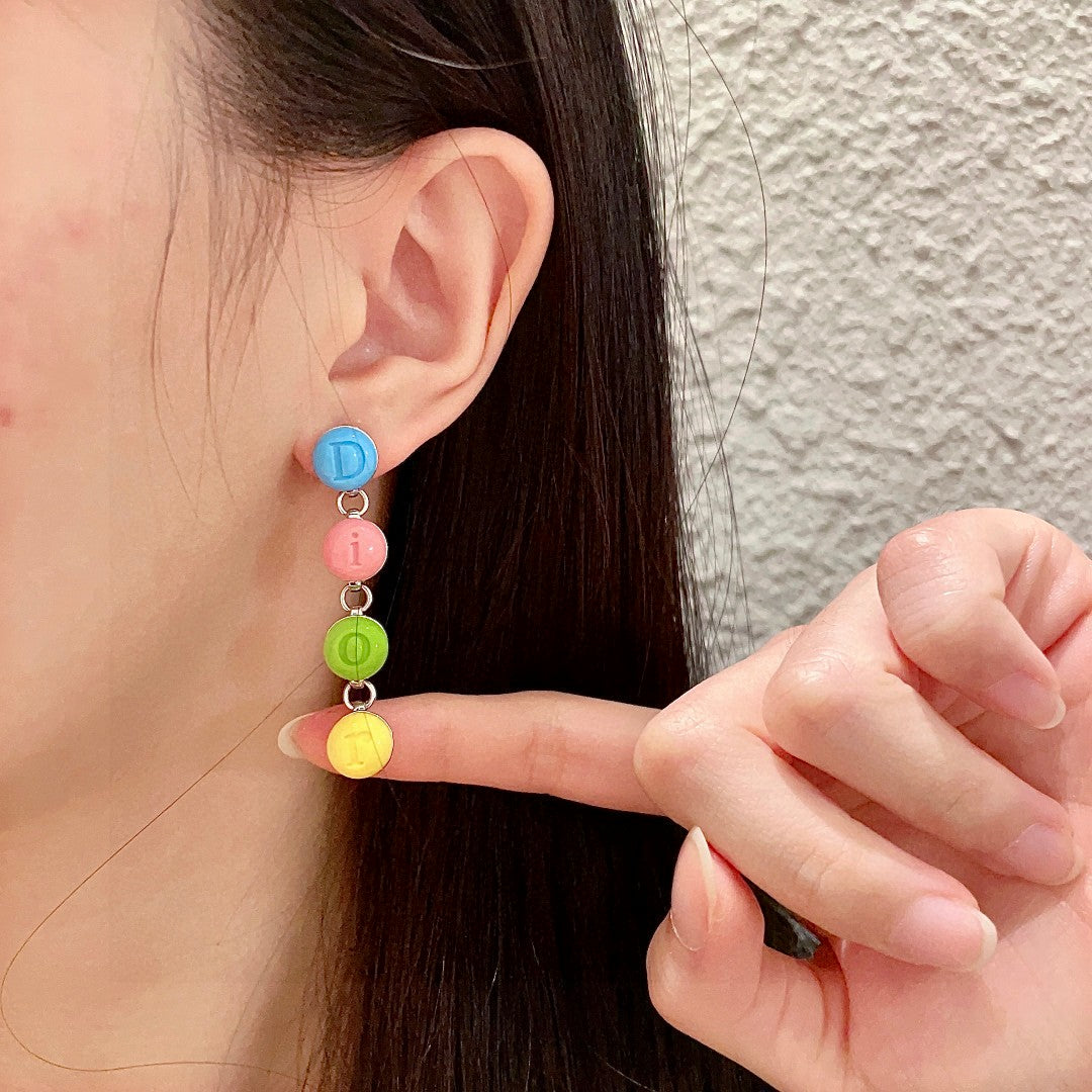 Martin Graham earrings in polished metal-tone – front view