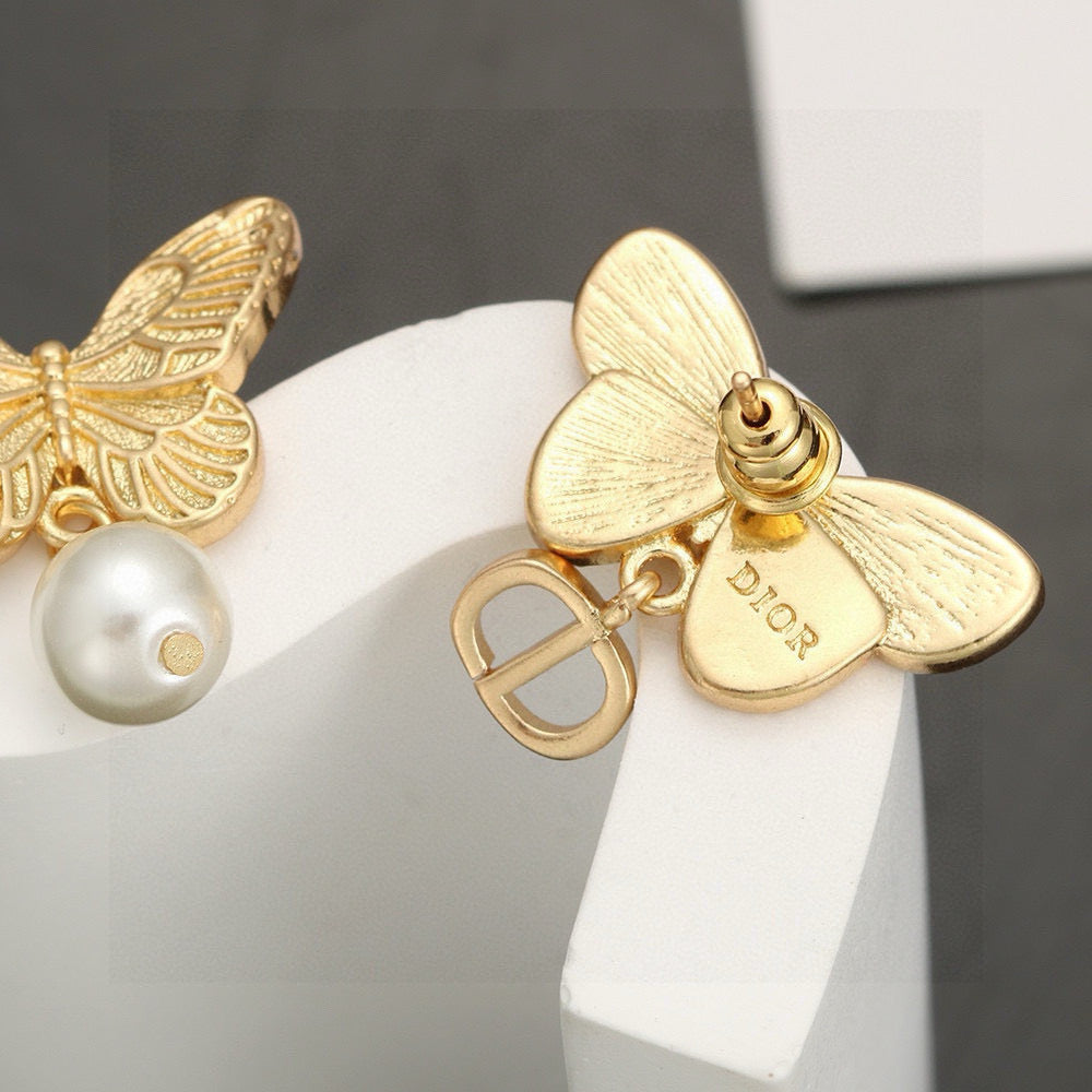 Martin Graham stud earrings in polished metal-tone – front view