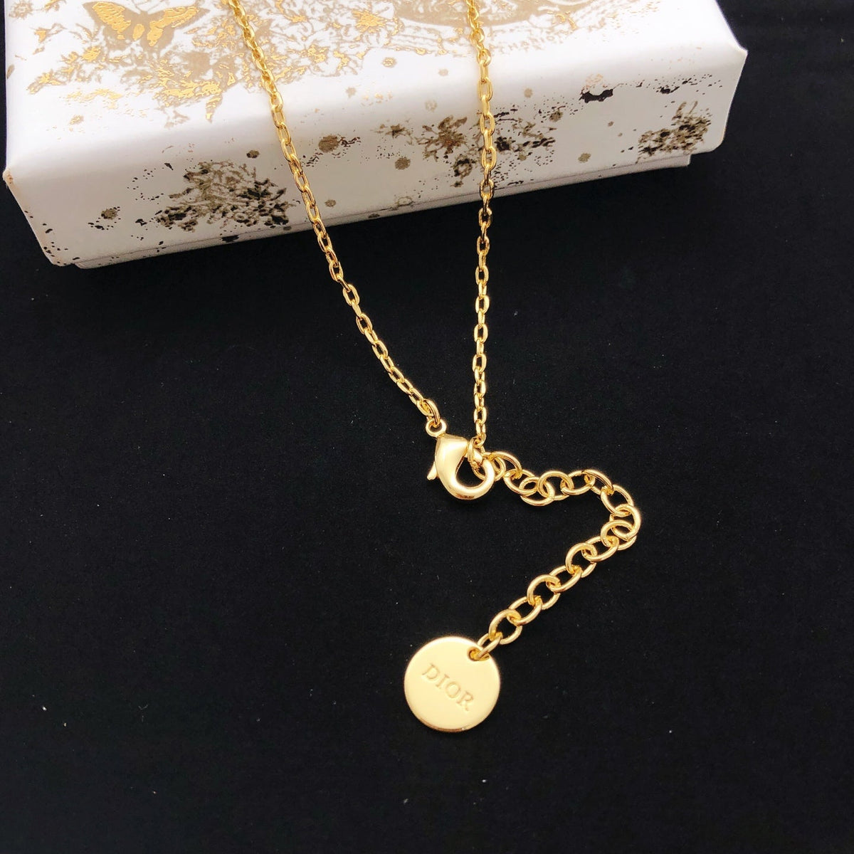 Martin Graham pendant necklace in polished metal-tone – front view