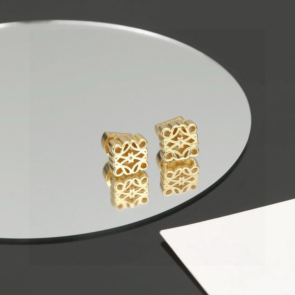 Martin Graham stud earrings in polished metal-tone – front view