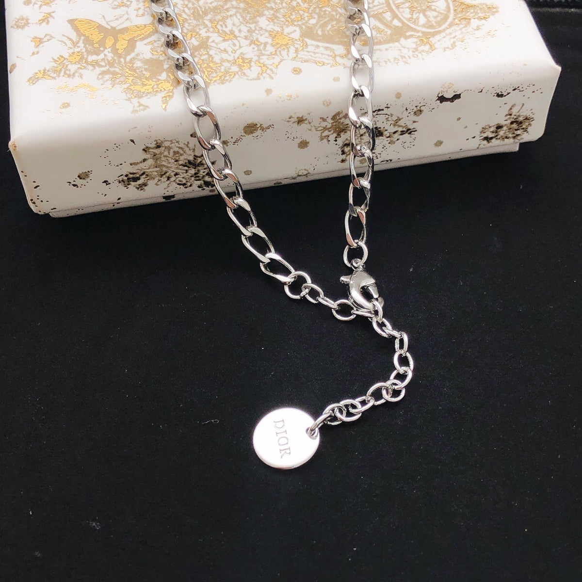 Martin Graham pendant necklace in polished metal-tone – front view