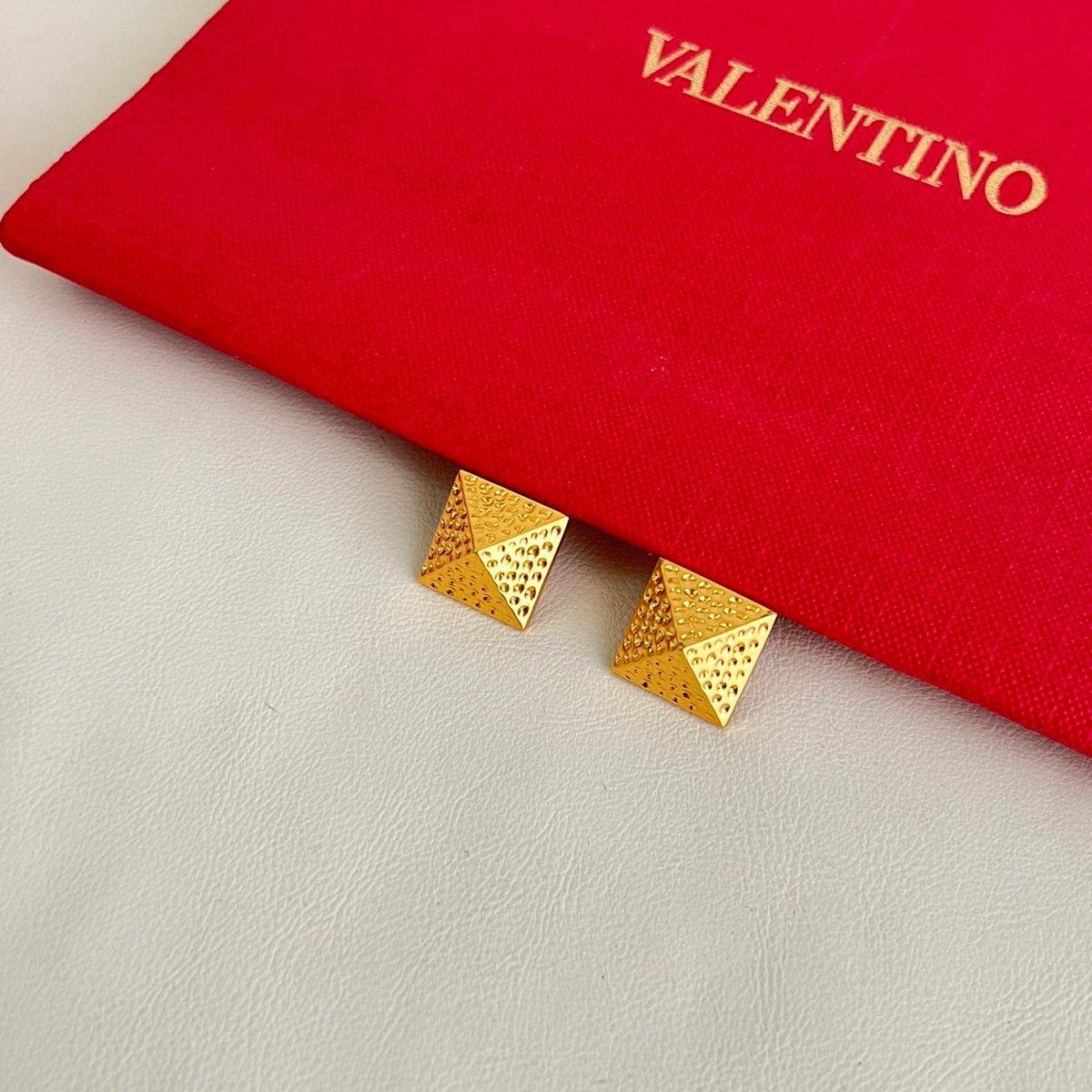 Martin Graham earrings in polished metal-tone – front view